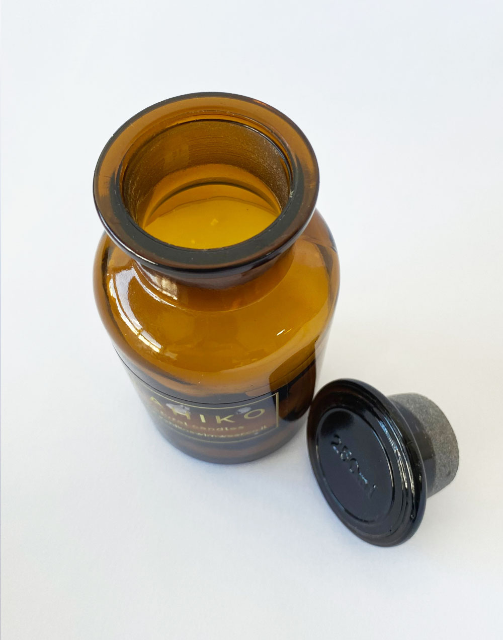 נר ריחני בבקבוק זכוכית בניחוח EBOONY WOODS